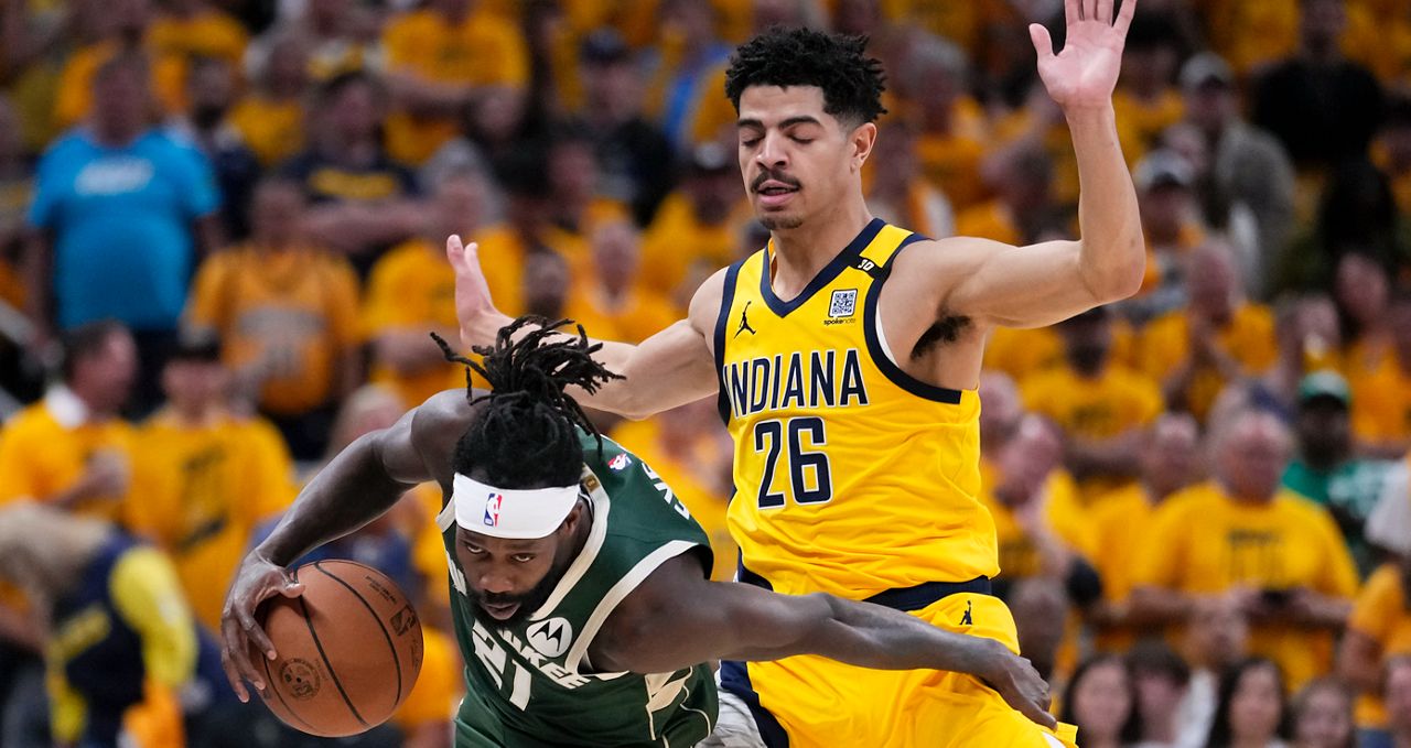 Milwaukee Bucks guard Patrick Beverley (21) drives up court past Indiana Pacers guard Ben Sheppard (26) during the second half in Game 6 in an NBA basketball first-round playoff series, Thursday, May 2, 2024, in Indianapolis. (AP Photo/Michael Conroy)