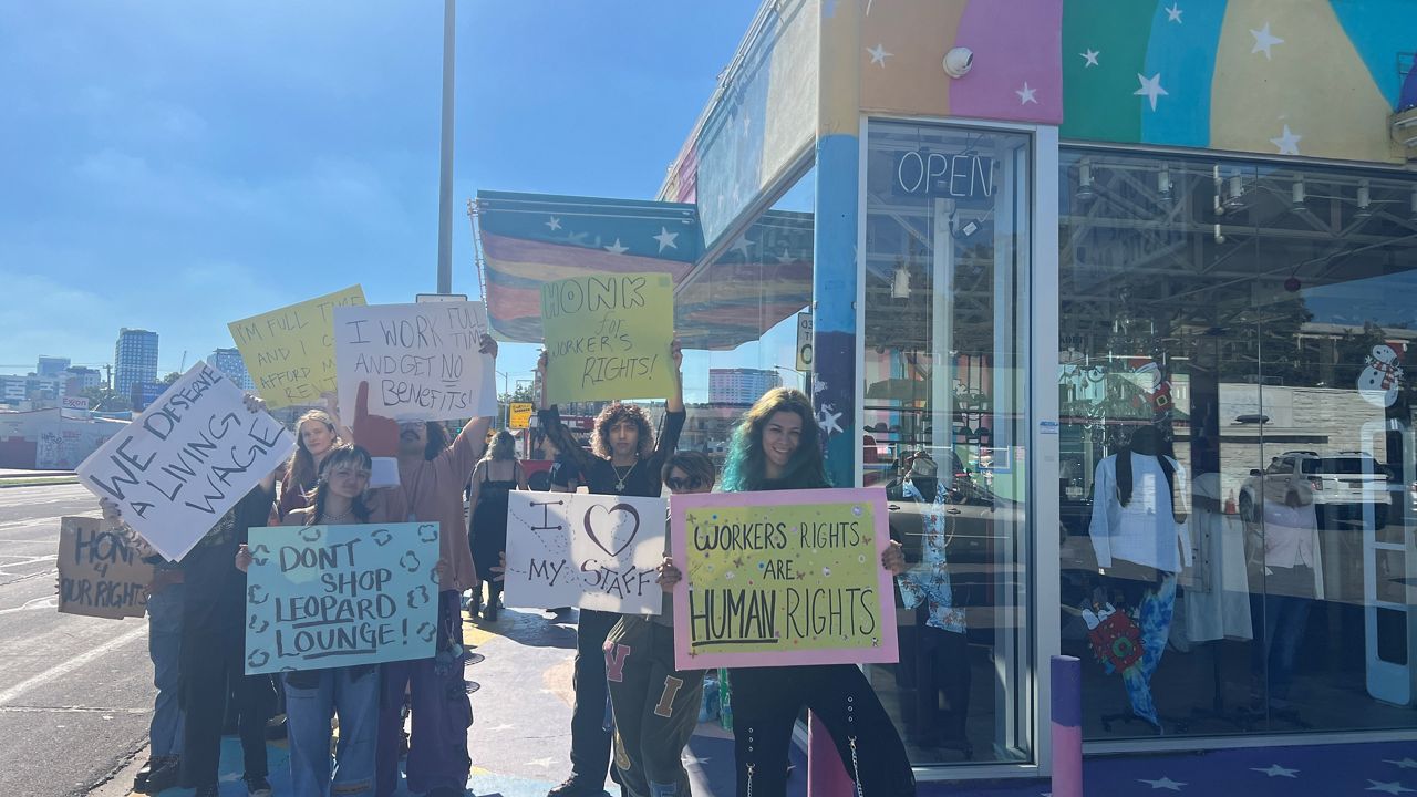 Workers protesting outside of Pavement thrift store on Guadalupe Street. (Spectrum News)