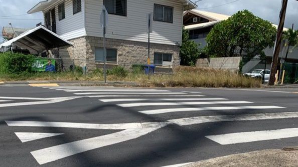 A raised crosswalk on Kalihi Street with striping to help make pedestrians more visible. (Photo courtesy of the City and County of Honolulu)