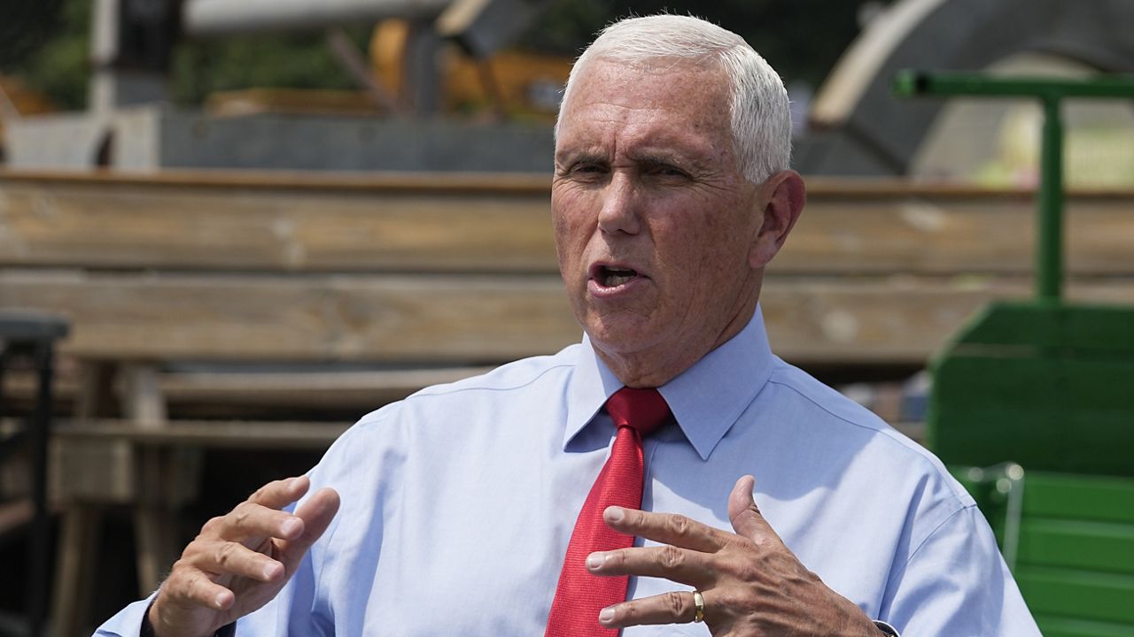 Republican presidential candidate and former Vice President Mike Pence speaks with the media during a stop at the Indiana State Fair, Wednesday, Aug. 2, 2023, in Indianapolis. (AP Photo/Darron Cummings)