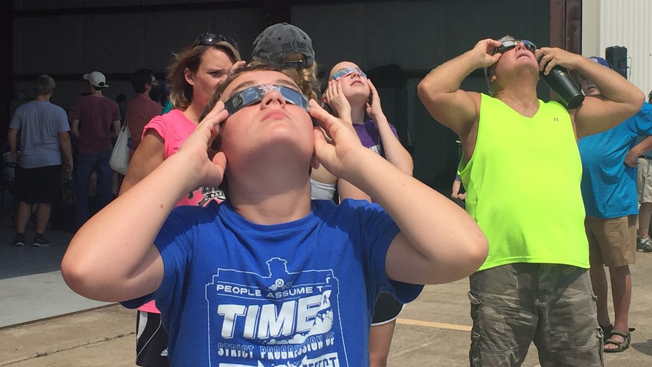 Visitors in Perryville take look at the solar eclipse in 2017. The city is on the path of totality for the upcoming April 8 solar eclipse. (Photo courtesy of Perry County)