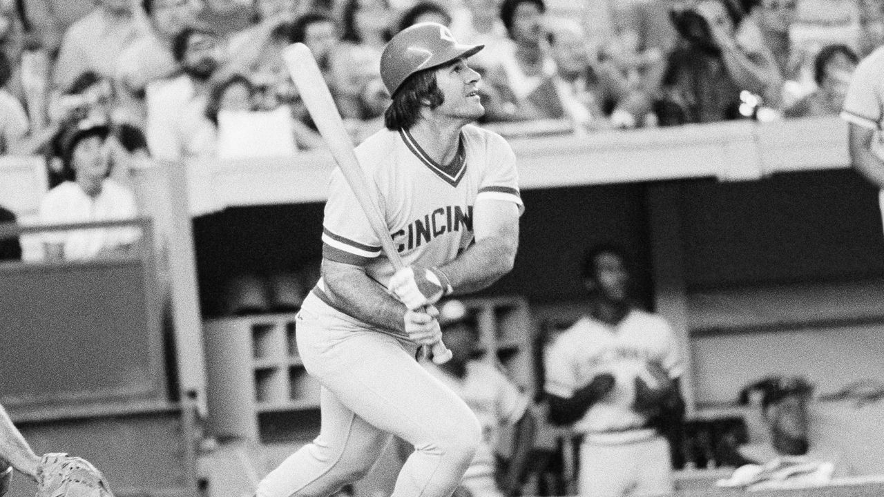 Cincinnati Reds' Pete Rose flies out in the first inning of a baseball game against the New York Mets, July 24, 1978, at New York's Shea Stadium. Rose agreed to a lifetime ban in 1989 after an investigation for Major League Baseball by lawyer John Dowd found the all-time hit leader placed bets on the Reds to win from 1985-87 while playing for and managing the team. (AP Photo/G. Paul Burnett, File)