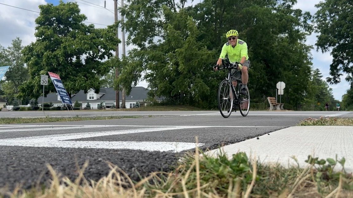 Peter Forrestel rides on the bike path in Clarence, NY.