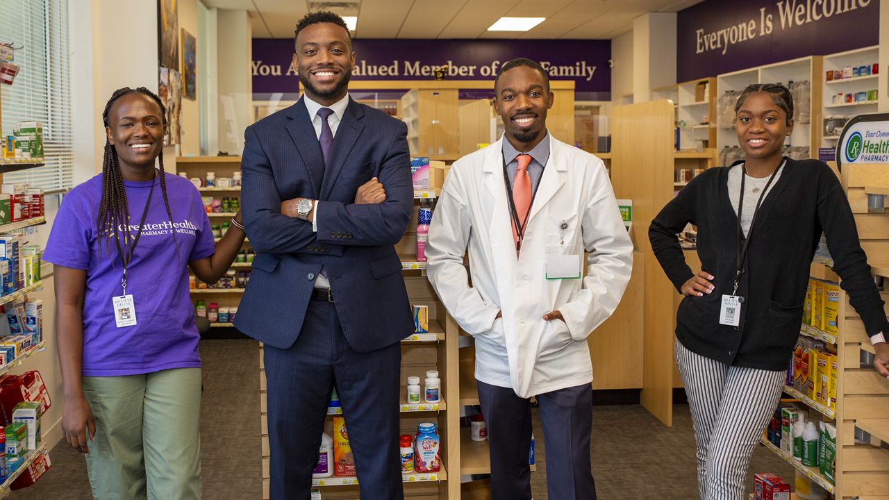Members of GreaterHealth Pharmacy and Wellness, from left, are Mary Ndung’u, manager of pharmacy operations, Dr. Marcus Howard, founder and CEO, Dr. Kenneth Powell, chief pharmacy officer, and Nieja Crump, summer intern. (Photo courtesy of Marcus Howard)