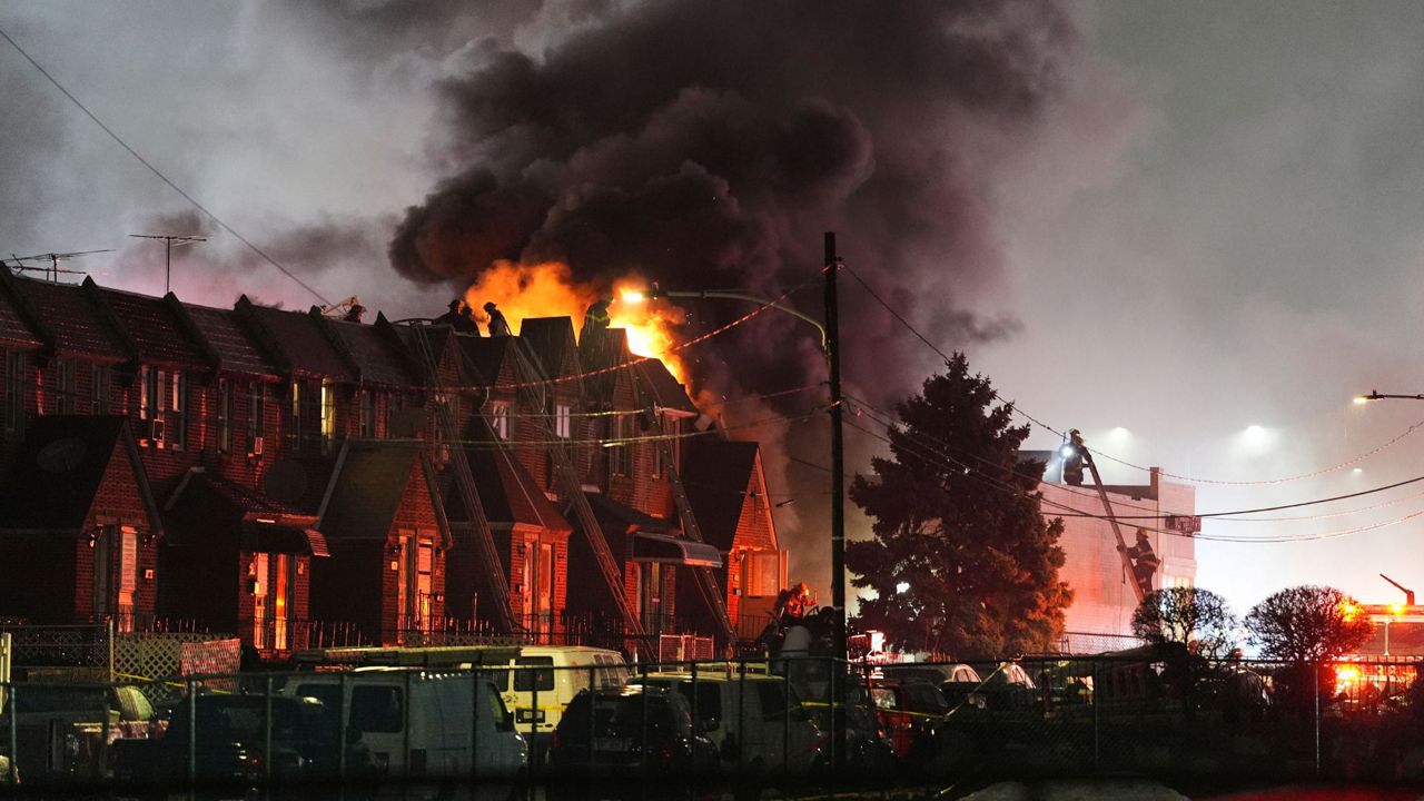 First responders work the scene after a small plane crashed in Philadelphia, Friday, Jan. 31, 2025. (AP Photo/Matt Rourke)