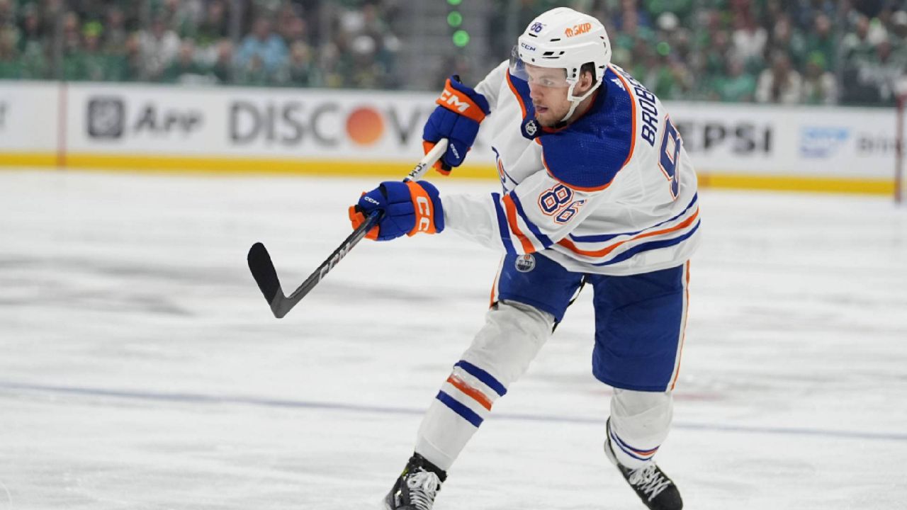 Edmonton Oilers defenseman Philip Broberg shoots against the Dallas Stars during the second period of Game 5 of the Western Conference finals in the NHL hockey Stanley Cup playoffs Friday, May 31, 2024, in Dallas. (AP Photo/Julio Cortez, File)