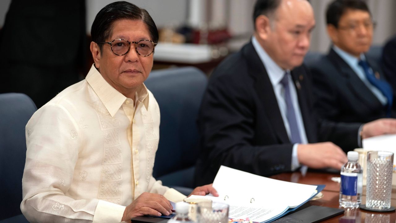 Philippine President Ferdinand Marcos Jr., left, attends a meeting with Secretary of Defense Pete Hegseth at the Pentagon, Monday, July 21, 2025, in Washington. (AP Photo/Mark Schiefelbein)