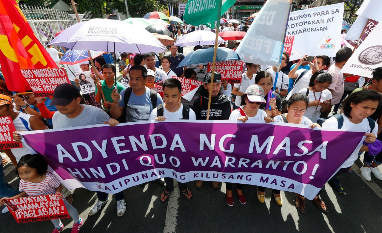 Protesters warn democracy at risk if Filipino justice ousted