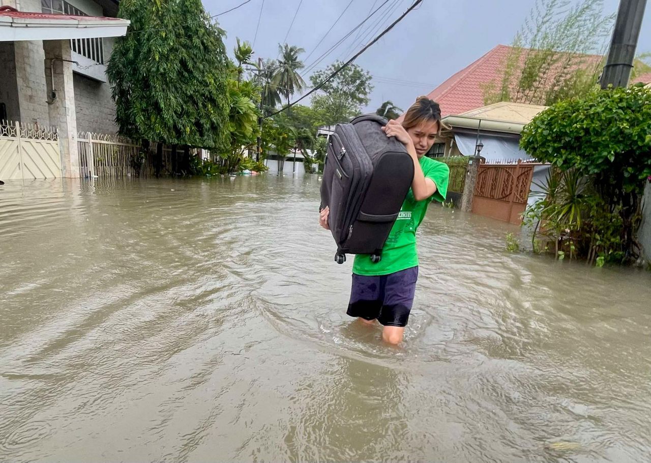 Tens of thousands of people evacuate to safety as typhoon approaches ...