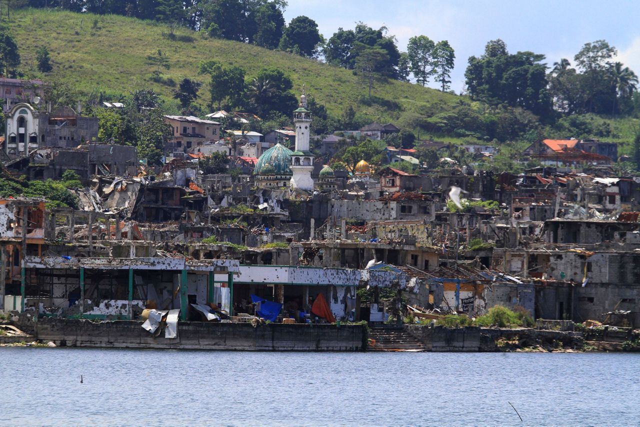 Philippines struggles with evacuees, bombed city after siege