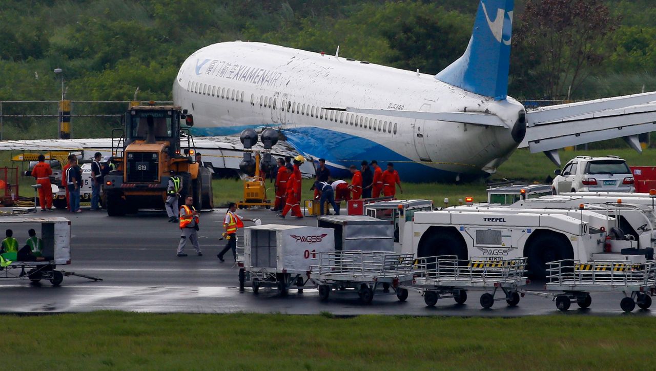 Plane from China skids off Manila runway amid downpour