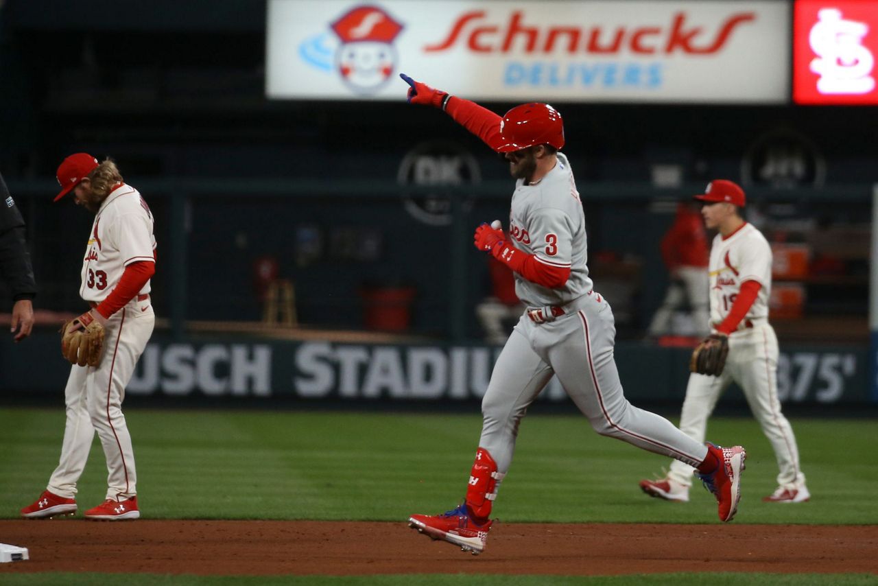 St. Louis Cardinals starter Miles Mikolas wipes his head and face