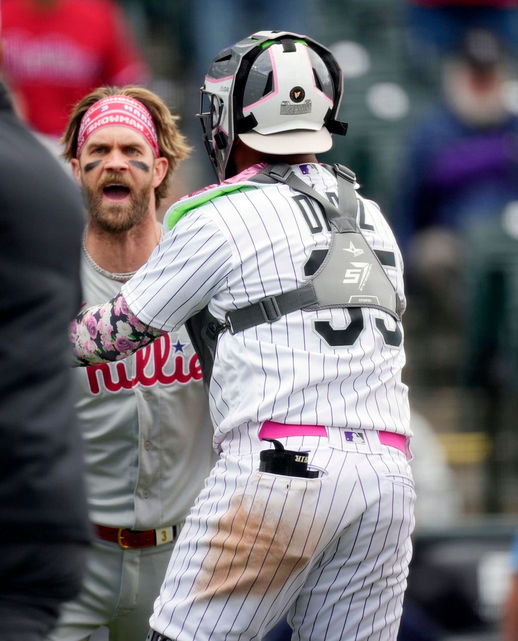 Phillies' Bryce Harper ejected after charging Rockies dugout