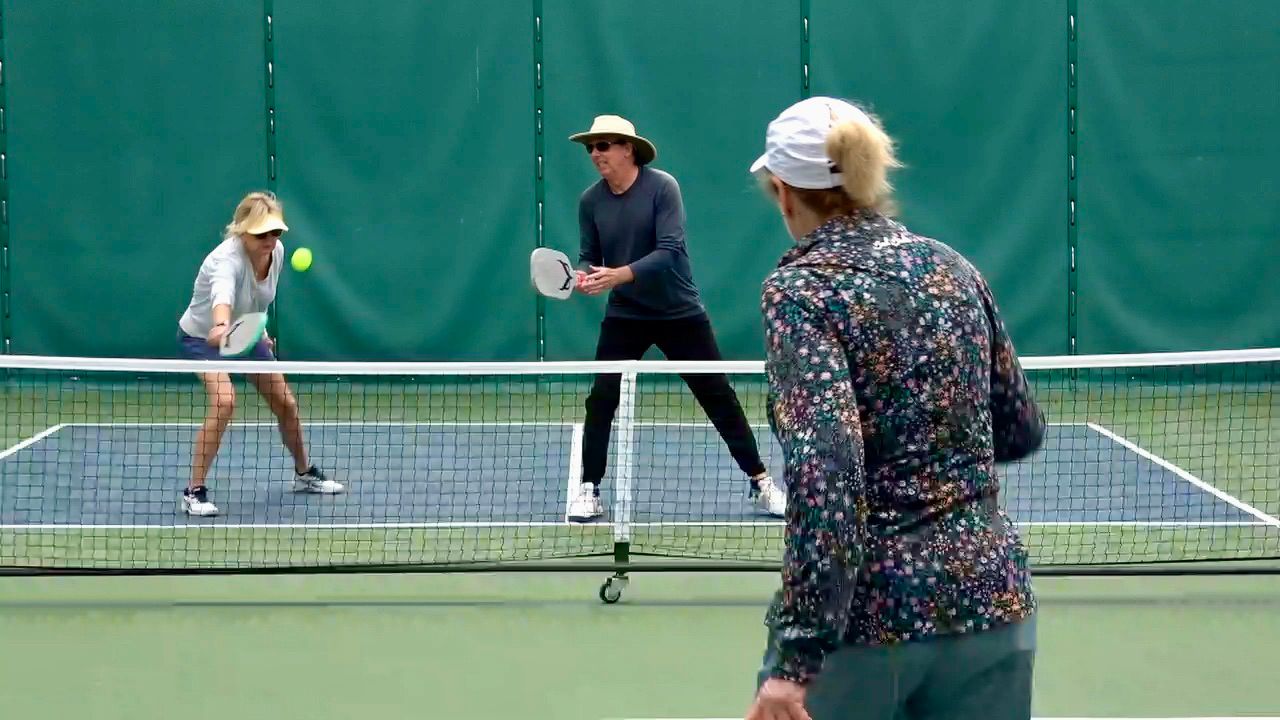 Pickleball players at Lang Park in Laguna Beach hit the ball with quiet paddles.
