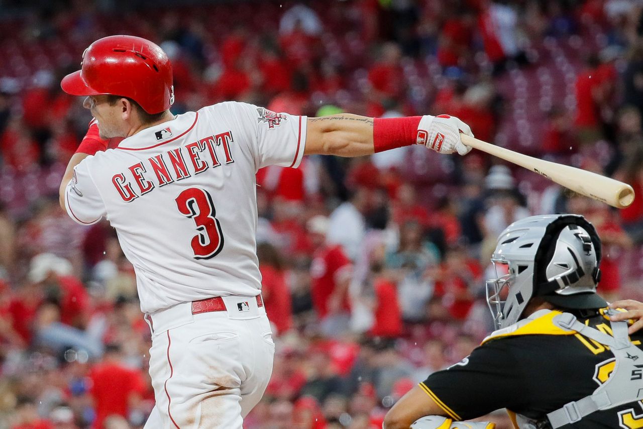 3 of 3. Cincinnati Reds' Scooter Gennett hits an RBI-double off Pittsb...
