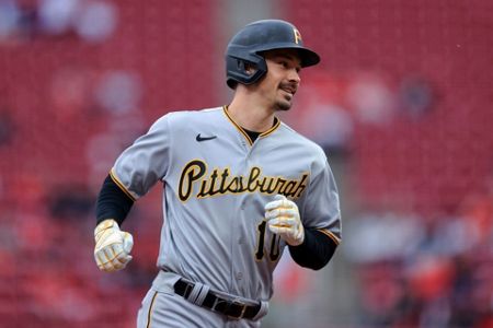 Pirates' VanMeter struggles as catcher, Reds end 9-game skid