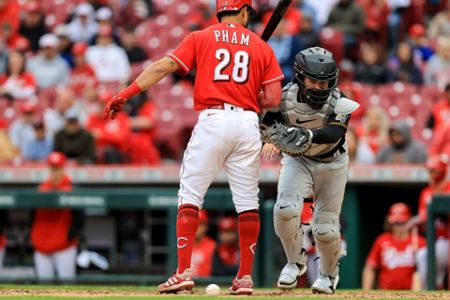 Pirates' VanMeter struggles as catcher, Reds end 9-game skid