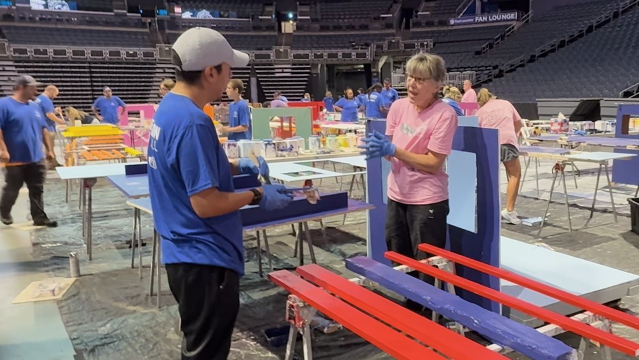 Volunteers build playhouses to fund habitat homes