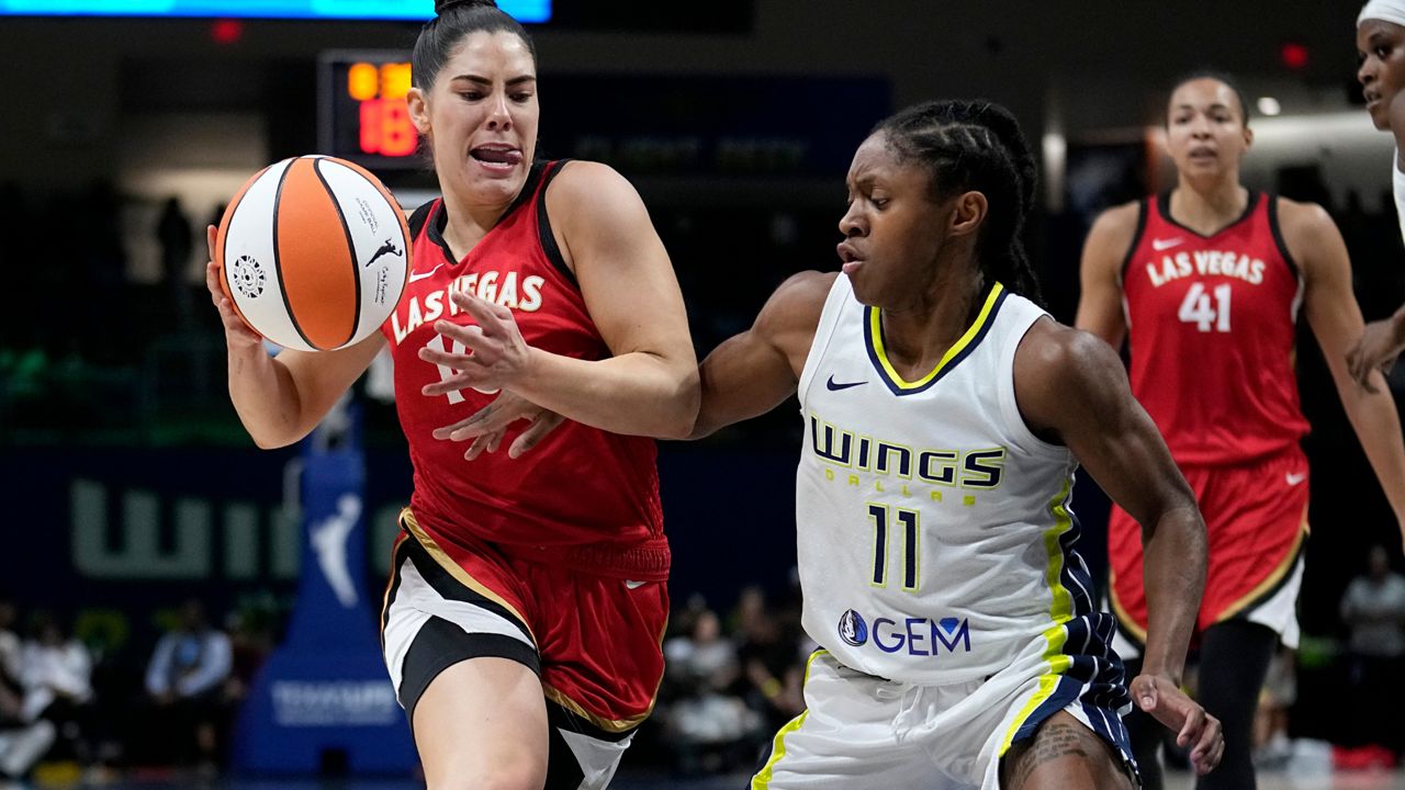 Kelsey Plum of the Las Vegas Aces celebrates during the 2022 WNBA