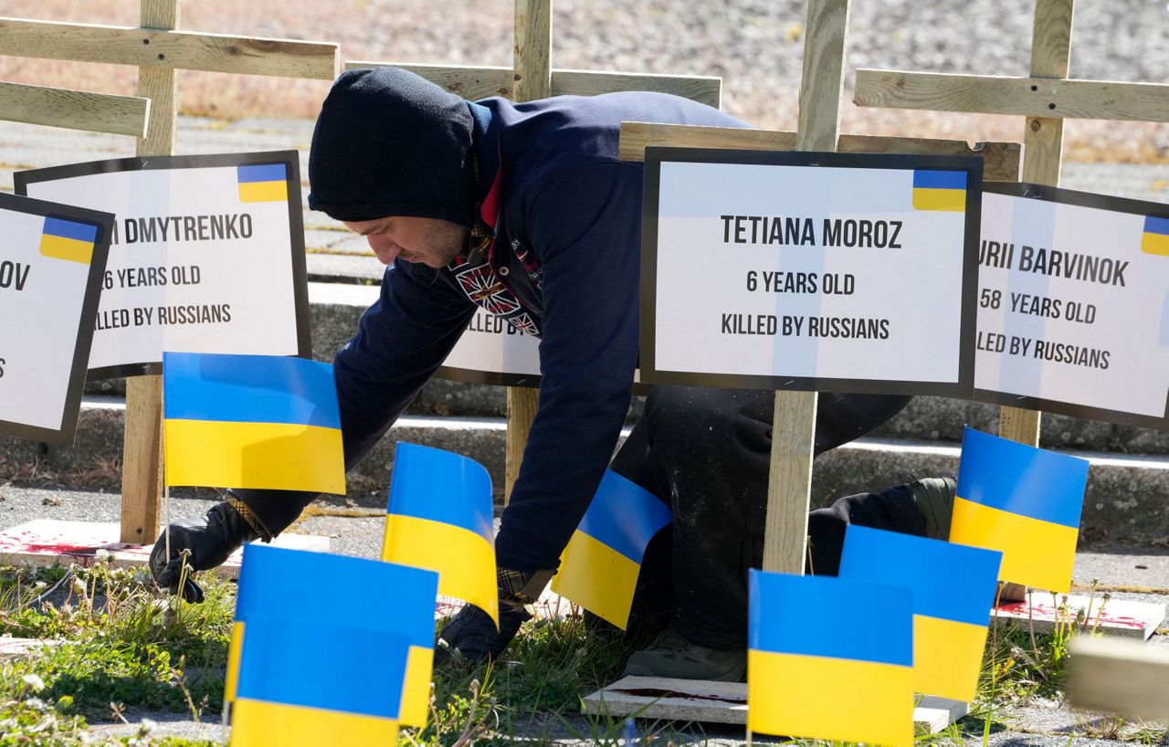 Ukraine flags block Russian ambassador's path on Victory Day