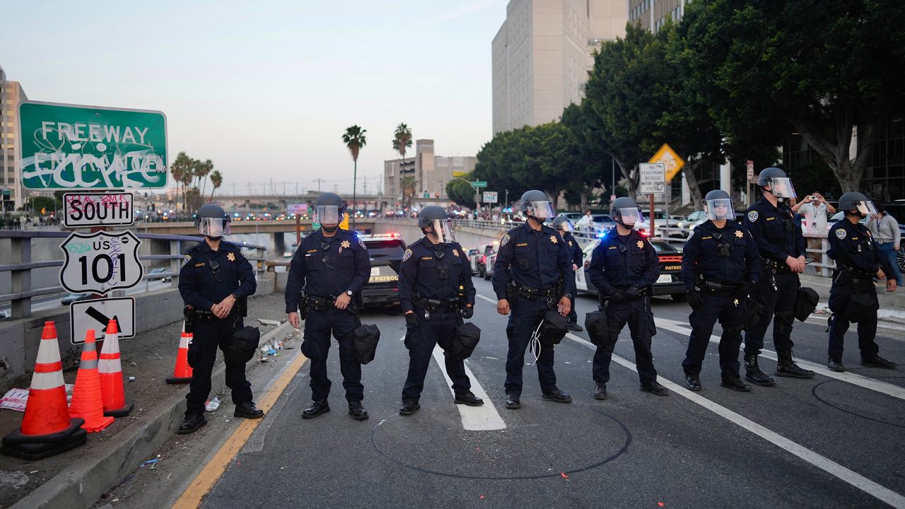 California Highway Patrol officers block a U.S. 101 freeway ramp during protests on Tuesday, June 10, 2025, in Los Angeles. (AP Photo/Eric Thayer)