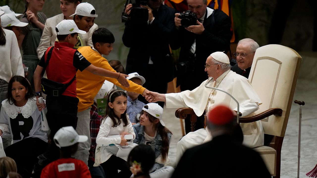 Pope Francis holds an audience with children from all over the world in the Paul VI Hall at The Vatican, Monday, Nov. 6, 2023. (AP Photo/Alessandra Tarantino)