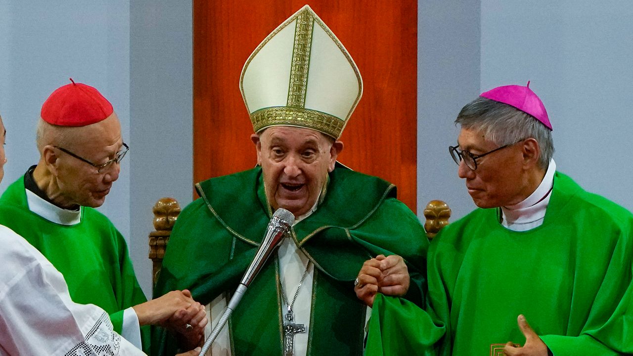 Pope Francis is joined by Cardinal John Tong Hon, left, and Cardinal-elect Stephen Chow, both from Hong Kong, after presiding over a mass at the Steppe Arena in the Mongolian capital Ulaanbaatar, Sunday, Sept. 3, 2023. Francis is in Mongolia to minister to one of the world's smallest and newest Catholic communities. Neighboring China's crackdown on religious minorities has been a constant backdrop to the trip, even as the Vatican hopes to focus attention instead on Mongolia and its 1,450 Catholics. (AP Photo/Ng Han Guan)