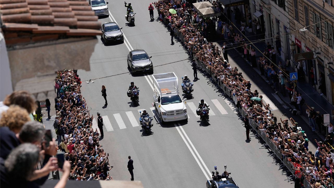 The coffin of Pope Francis makes its way to St. Mary Major Basilica in Rome, Saturday, April 26, 2025. (AP Photo/Luca Bruno)