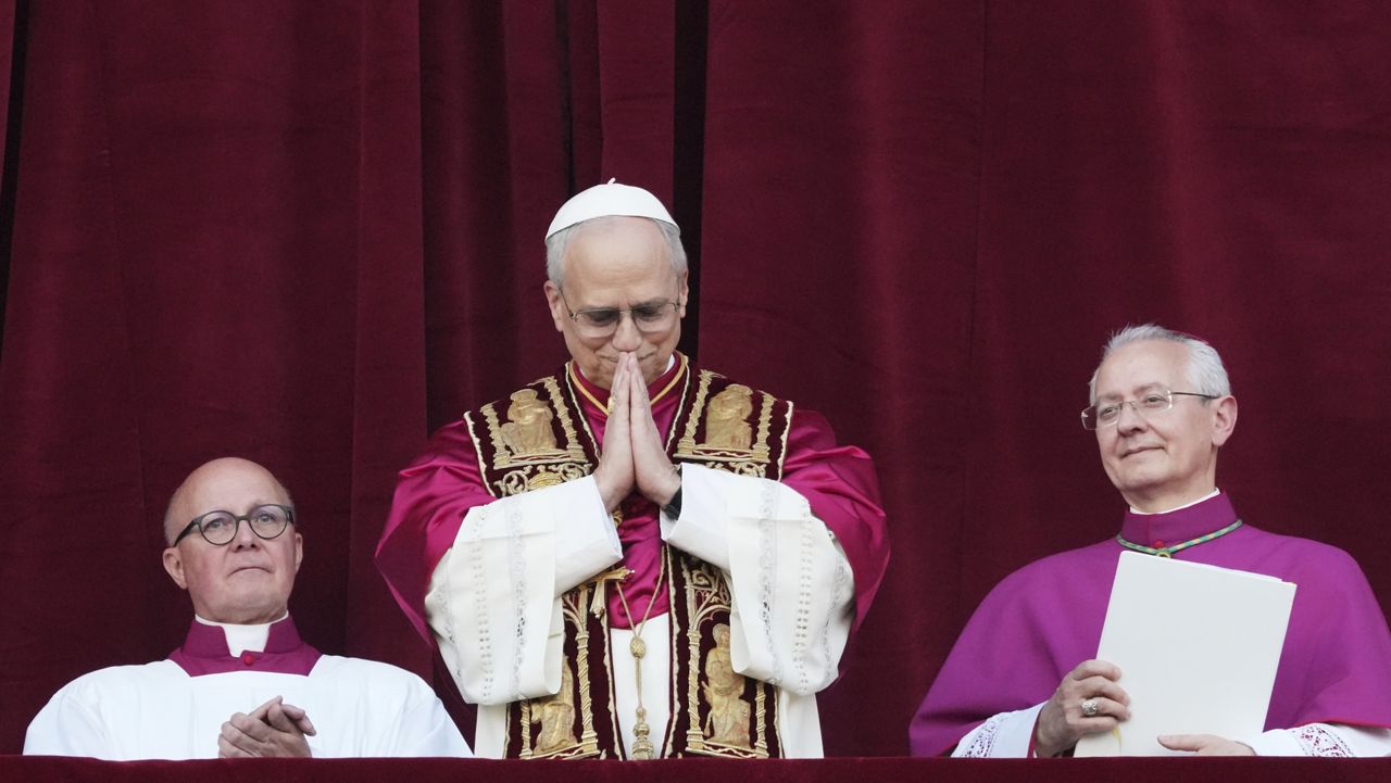 Cardinal Robert Prevost appears on the central loggia of St. Peter's Basilica after being chosen the 267th pontiff of the Roman Catholic Church, choosing the name of Pope Leo XIV, at the Vatican, Thursday, May 8, 2025. (AP Photo/Alessandra Tarantino)