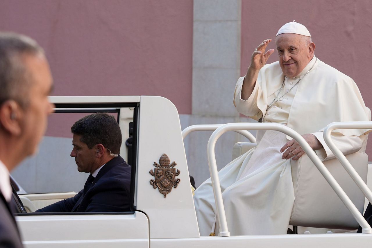 Pope visits a once-troubled Lisbon neighborhood and says true charity ...