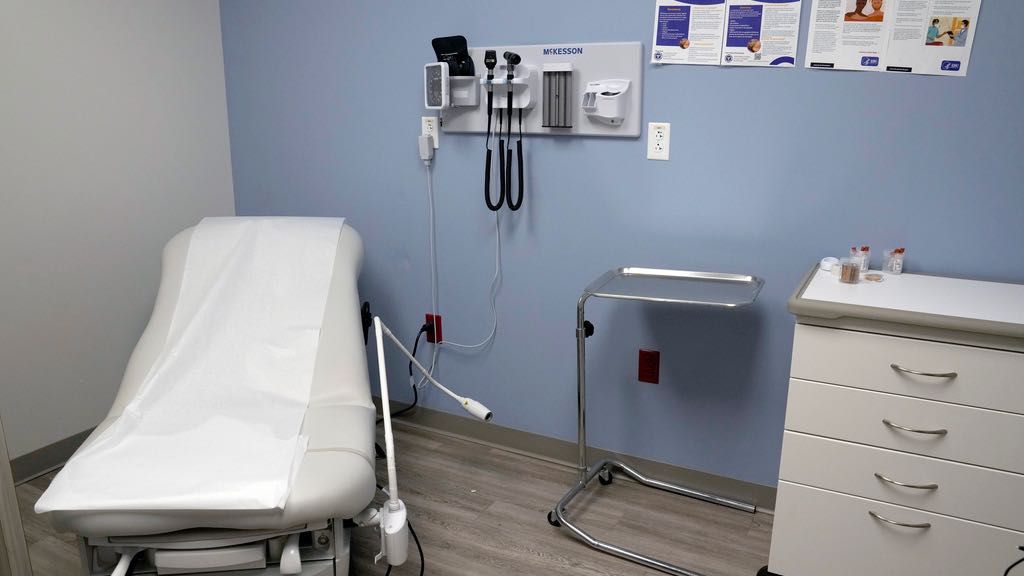 An exam room is seen inside Planned Parenthood on March 10, 2023. A lawsuit filed by 17 states challenging federal rules entitling workers to time off and other accommodations for abortions lacks standing, a federal judge in Arkansas ruled on Friday, June 14, 2024 (AP Photo/Jeff Roberson, File)