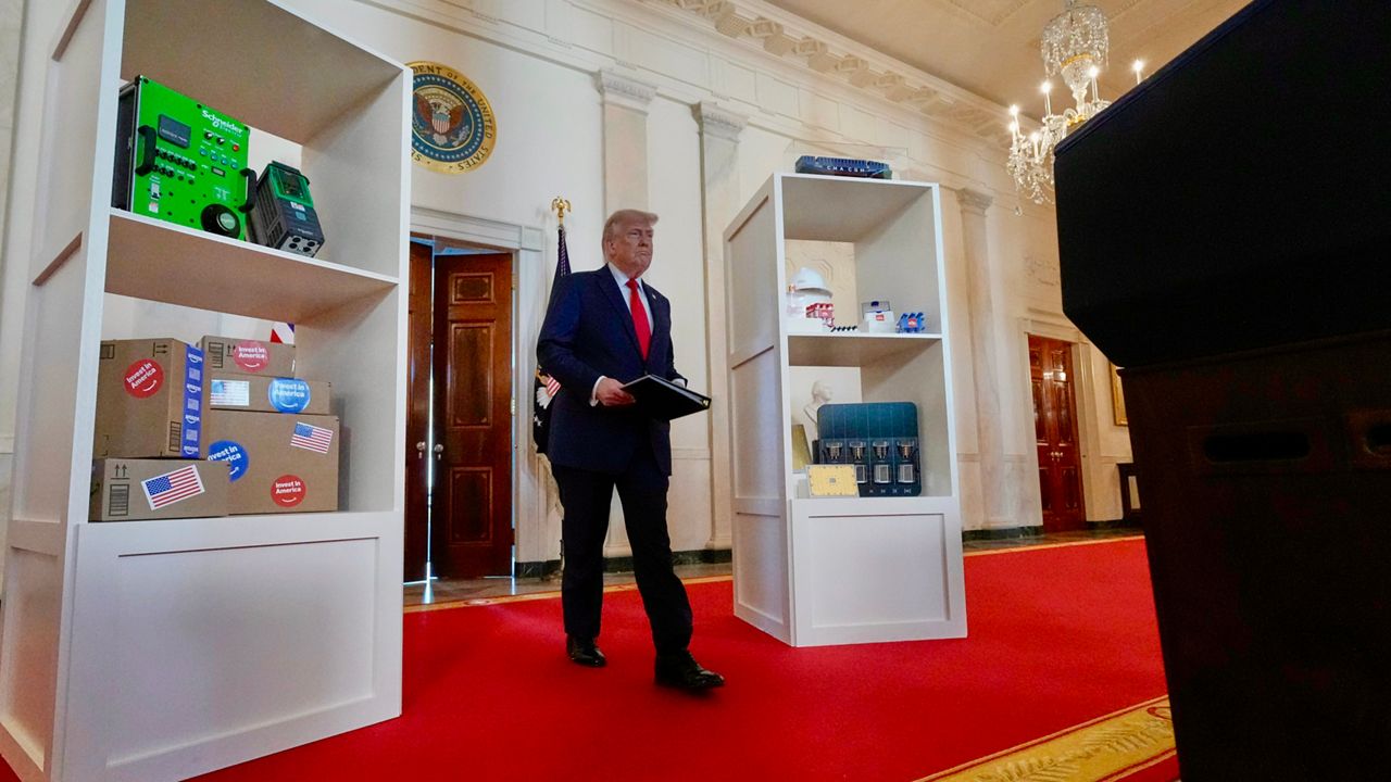 President Donald Trump arrives to speak about investing in America in the Cross Hall of the White House, Wednesday, April 30, 2025, in Washington. (AP Photo/Alex Brandon)