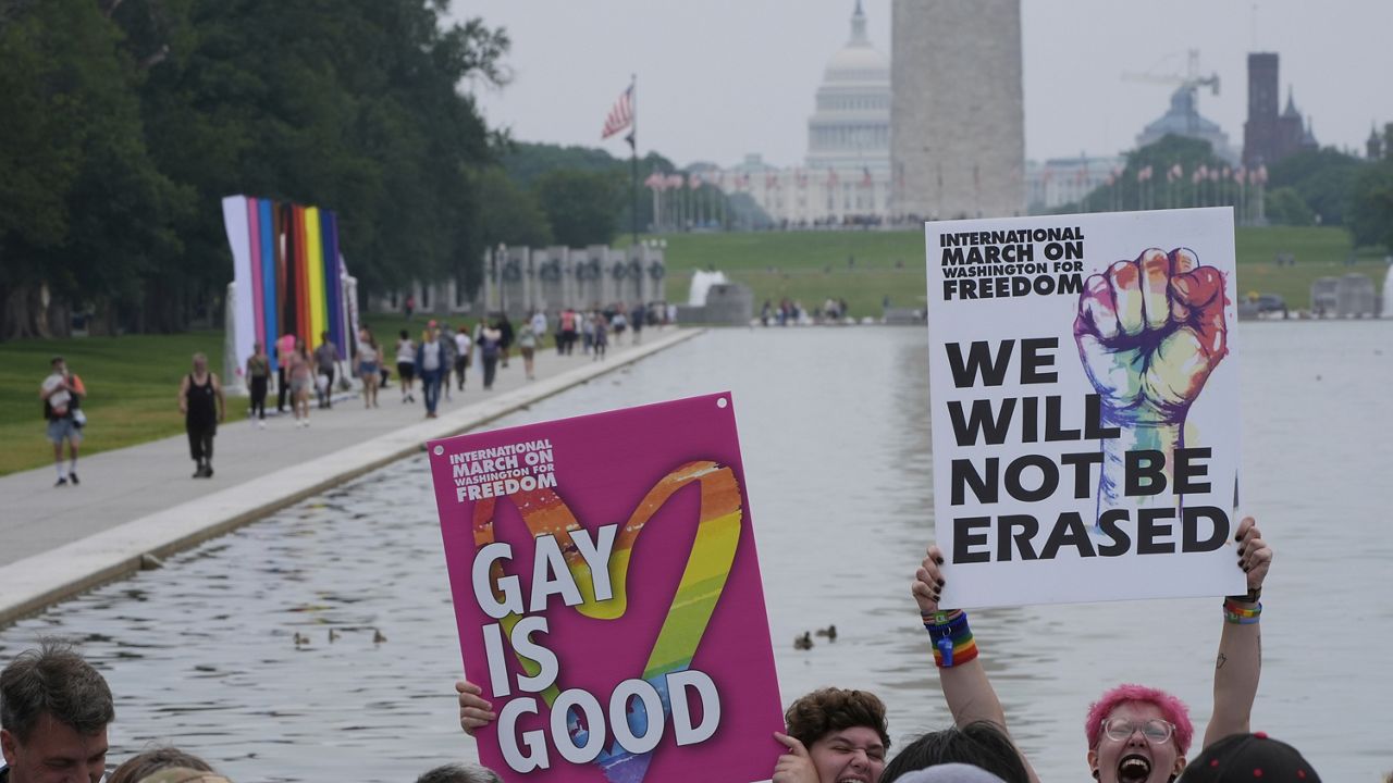 People attend the World Pride Rally and March at the Lincoln Memorial, Sunday, June 8, 2025, on the National Mall in Washington. (AP Photo/Alex Brandon)