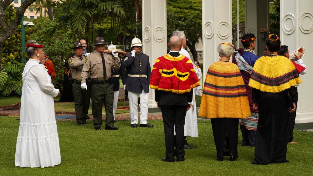 Representatives from various organizations gather to welcome the arrival of Queen Liliʻuokalani’s Royal Standard after it was forcibly taken down following the monarchy’s overthrow on Jan. 17, 1893. (Spectrum News/Sarah Yamanaka)