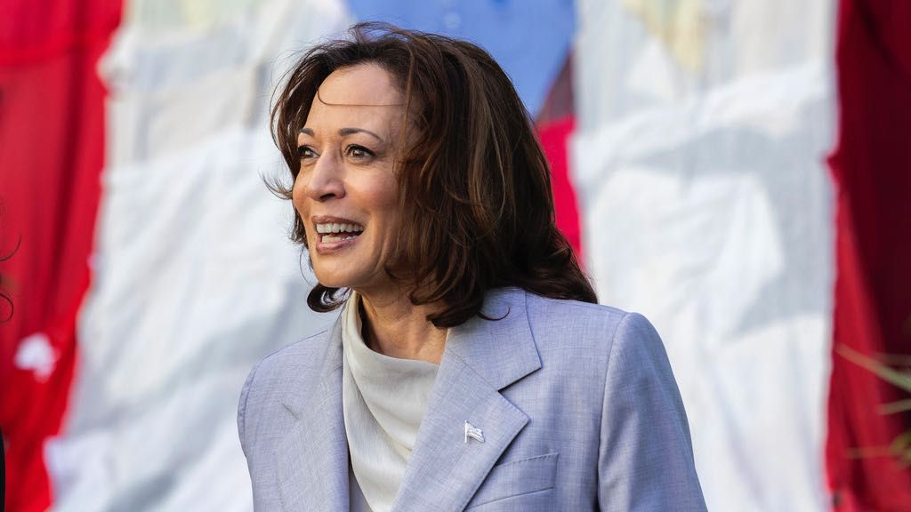 Vice President Kamala Harris stands in front of a Puerto Rican flag, in San Juan, Puerto Rico, Friday, March 22, 2024. (AP Photo/Alejandro Granadillo)