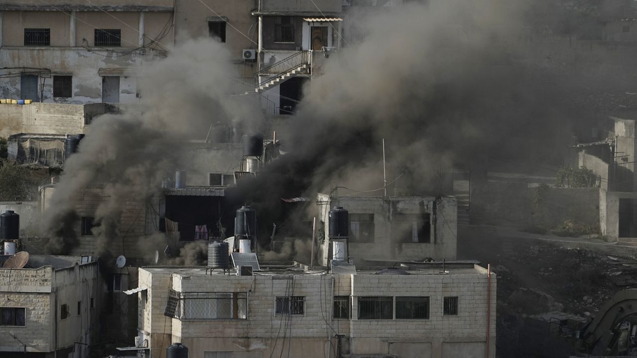 Houses are engulfed in fire as the Israeli army raided the northern West Bank town of Qabatiya on Thursday, Sept. 19, 2024. (AP Photo/Majdi Mohammed)