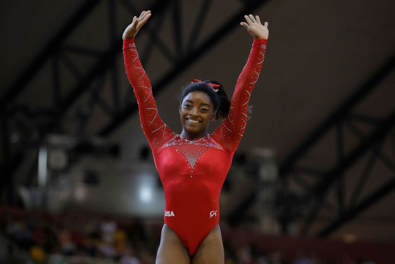 Simone Biles wraps up world gymnastics championships with 2 more