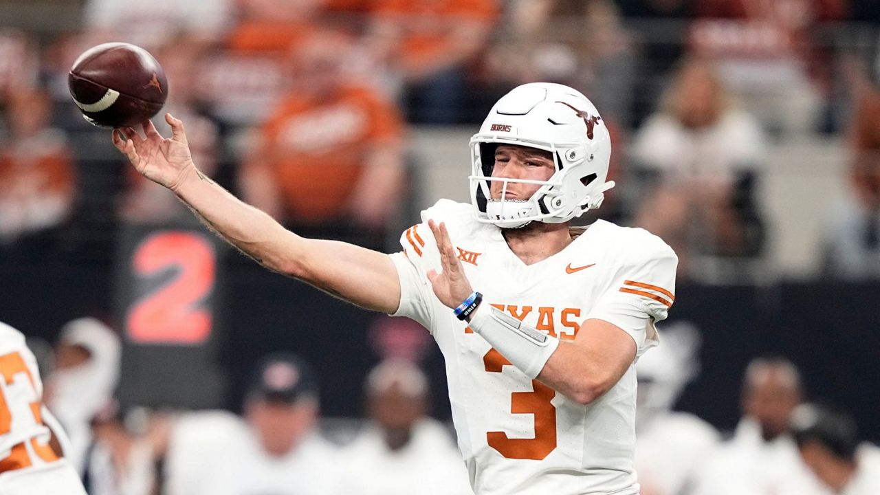 Texas quarterback Quinn Ewers throws a pass in the first half of the Big 12 Conference championship NCAA college football game against Oklahoma State in Arlington, Texas, Saturday, Dec. 2, 2023. (AP Photo/Tony Gutierrez)