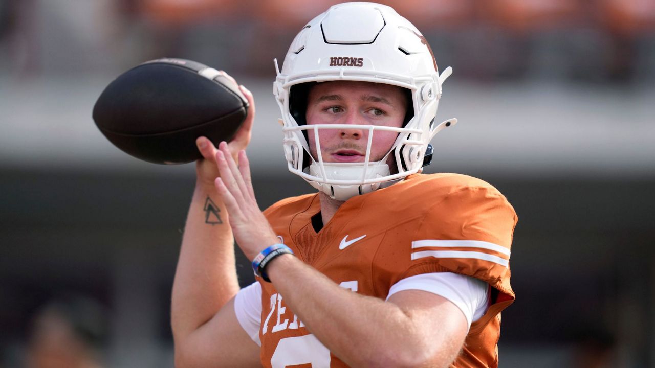 Texas quarterback Quinn Ewers (3) throws before an NCAA college football game against UTSA in Austin, Texas, Saturday, Sept. 14, 2024. (AP Photo/Eric Gay)