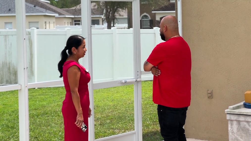 Real-estate agent Rosa Hughes guides first-time homebuyer Victor Alvarado through the process of buying a home. (Spectrum News 13/Barry Short)