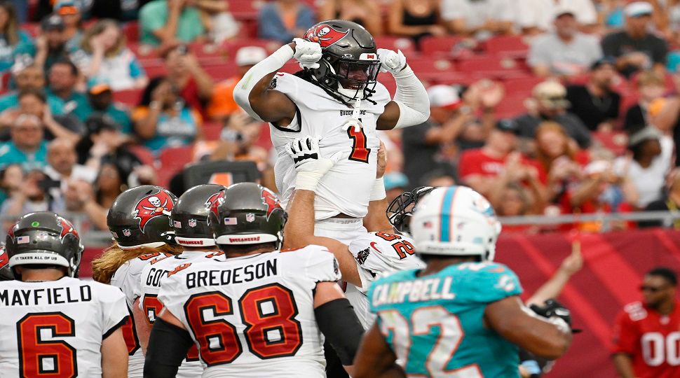 Tampa Bay Buccaneers running back Rachaad White (1) celebrates after scoring a touchdown during the first half of a pre season NFL football game against the Miami Dolphins, Friday, Aug. 23, 2024, in Tampa, Fla. (AP Photo/Jason Behnken )