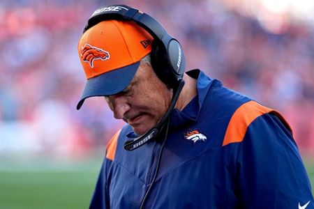 Head Coach Vic Fangio of the Denver Broncos wears an FDNY hat and