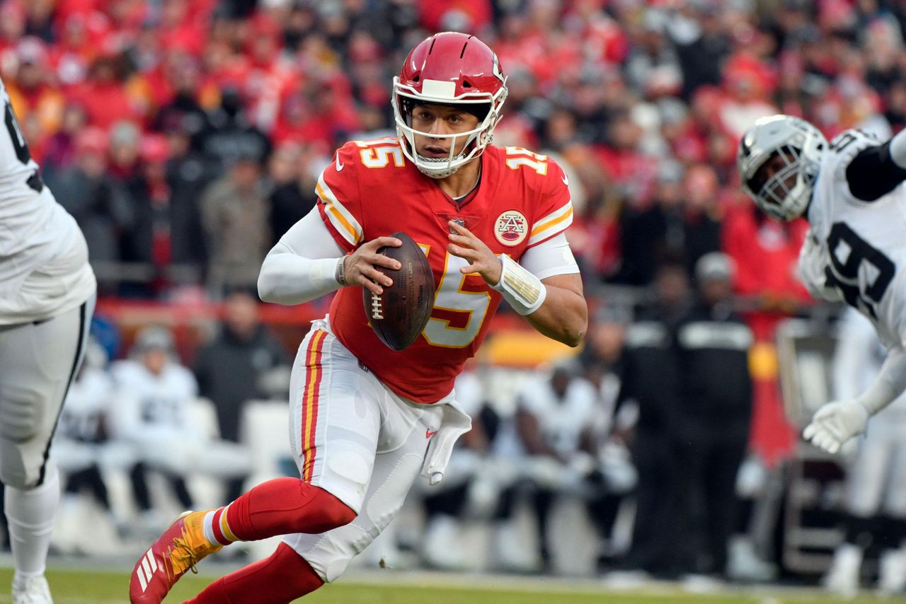 Kansas City Chiefs quarterback Patrick Mahomes (15) celebrates with tight  end Travis Kelce (87) after throwing a 67-yard touchdown pass to Tyreek  Hill during the first quarter of an NFL football game