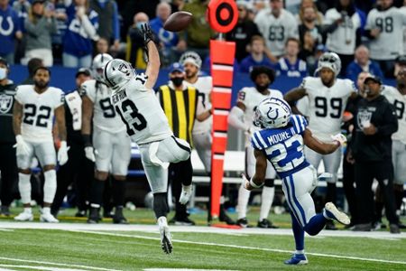 Las Vegas Raiders place kicker Daniel Carlson (2) after kicking field goal  during an NFL football game against the Seattle Seahawks, Sunday, Nov. 27,  2022, in Seattle, WA. The Raiders defeated the