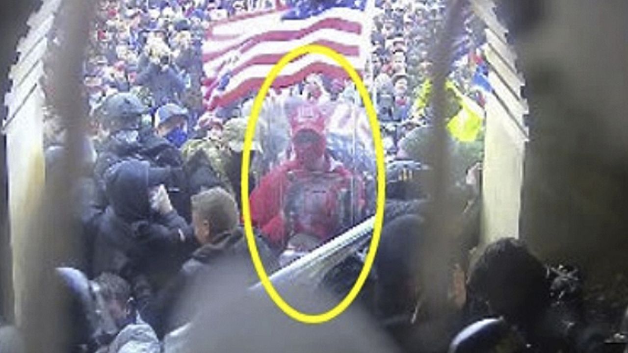 This image from police body-worn video and contained in the Justice Department statement of facts supporting the arrest of Rally Runner, shows Rally Runner outside the U.S. Capitol on Jan. 6, 2021, in Washington. Rally Runner, who legally changed his name from Daniel Donnelly Jr., pleaded guilty on Friday, March 22, 2024, to a felony charge of civil disorder and is scheduled to be sentenced in July. (Department of Justice via AP)