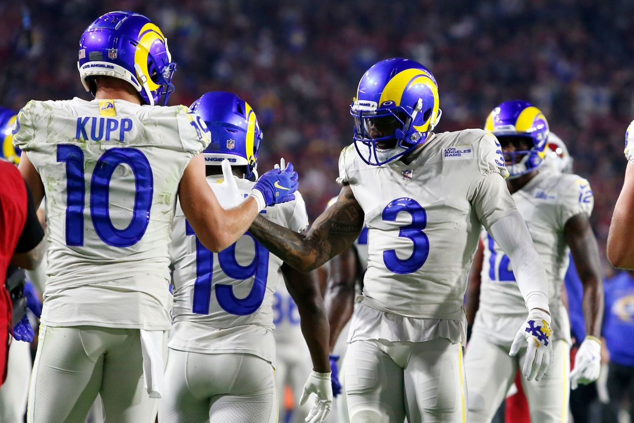 Los Angeles Rams wide receiver Odell Beckham Jr. puts on his helmet during  practice for an NFL …