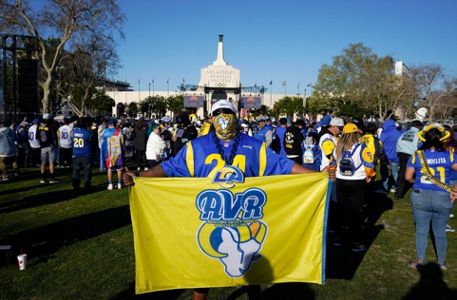 Los Angeles Rams wide receiver Cooper Kupp waves to fans at Rams parade  wearing Kobe Bryant jersey