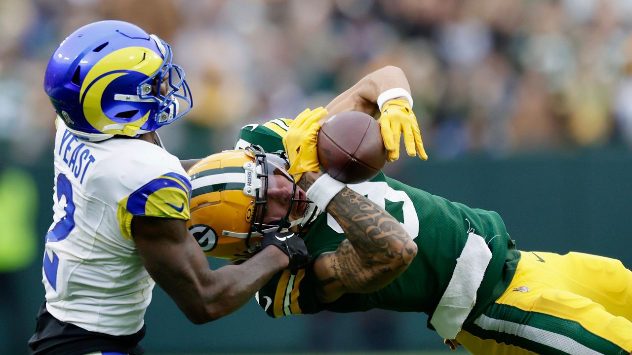 Rams Safety Russ Yeast makes a tackle against the Green Bay PAckers