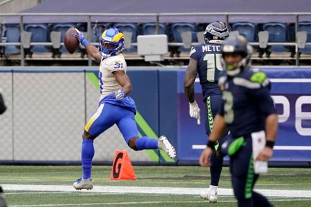 Los Angeles Rams outside linebacker Leonard Floyd (54) knocks the ball away  as Seattle Seahawks …