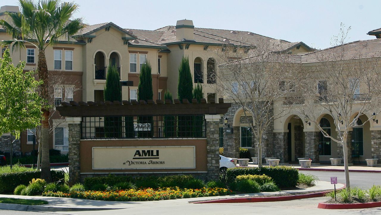 Federal agents raided about 20 locations, related to a birth tourism scheme, in three Southern California counties, including this apartment complex in Rancho Cucamonga, Calif., Tuesday, March 3, 2015. (Stan Lim/The Press-Enterprise via AP)